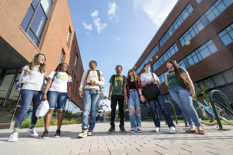Student Life Students pose for a photo in between Fenwick Library and Horizon Hall. Photo by Evan Cantwell/Creative Services/George Mason University